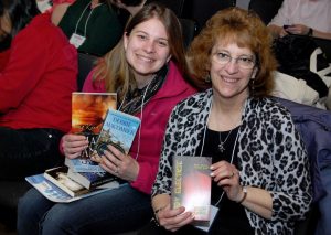 Readers showing off the books they received