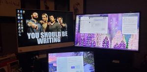 My current work set up – including my home PC telling me what I SHOULD be doing.